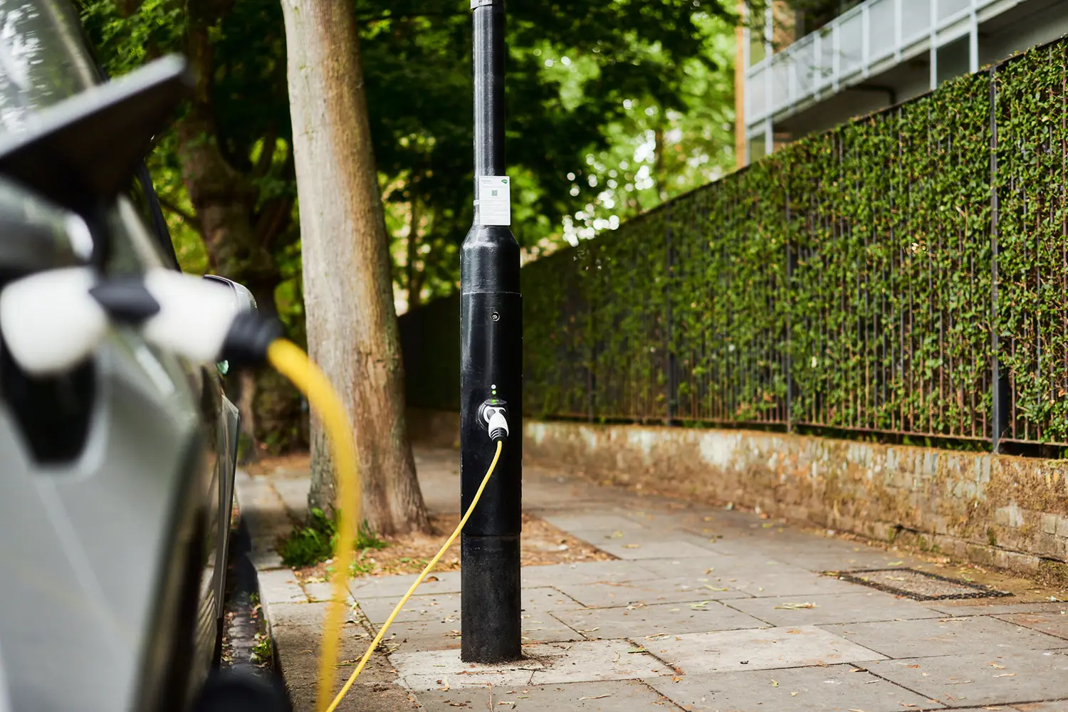 An EV is charging at an ubitricity lamppost charger in London, a company which received the 2018 climate action challenge award in New York City.