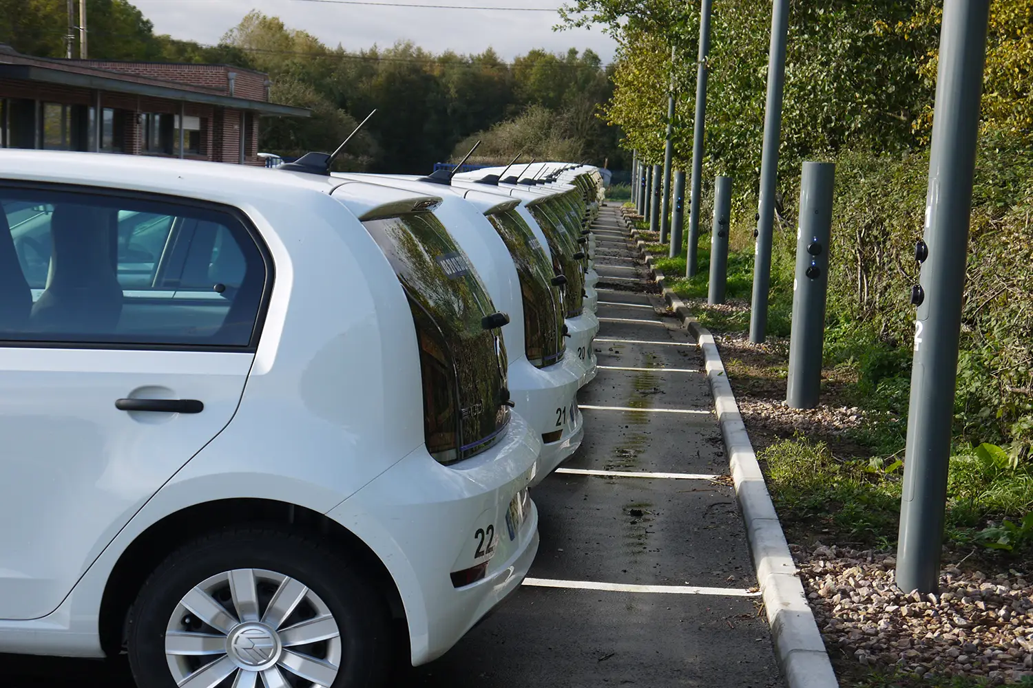 Several EVs are charging at ubitricity lamppost charge points in France.