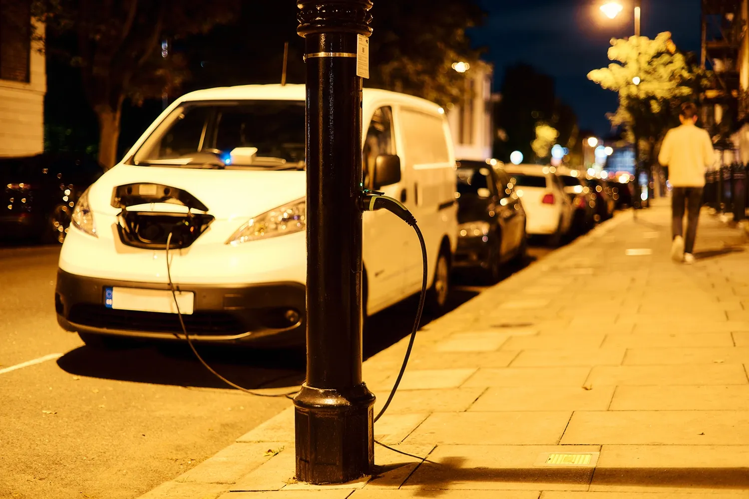 An EV van is charging overnight at an ubitricity street light charging station.